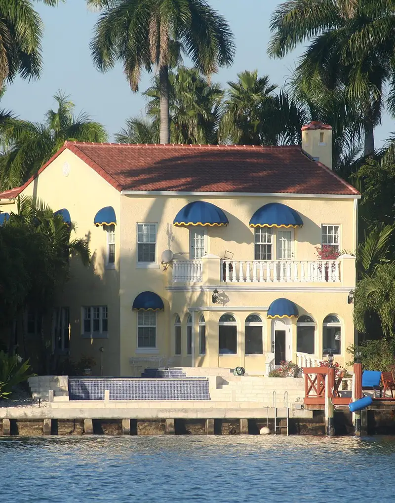 South Florida beach-area home exterior at dusk