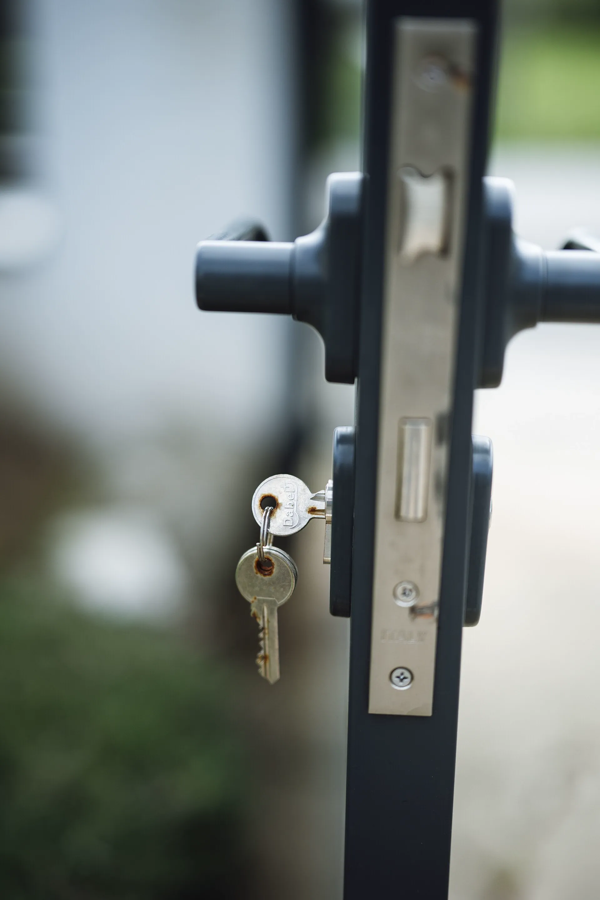 A key inserted in a door lock, illustrating access control during turnover