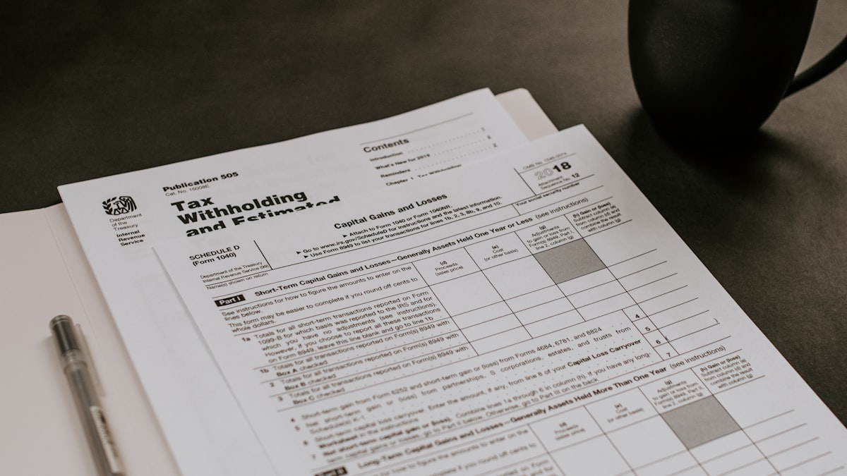 Tax forms, pen and calculator for Florida rental property tax deductions